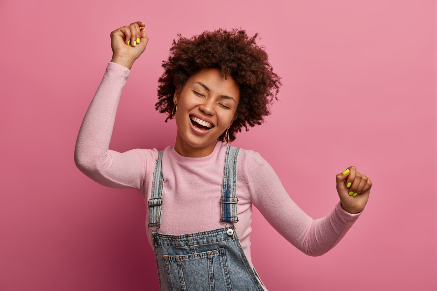 A young lady smiling and moving her hands