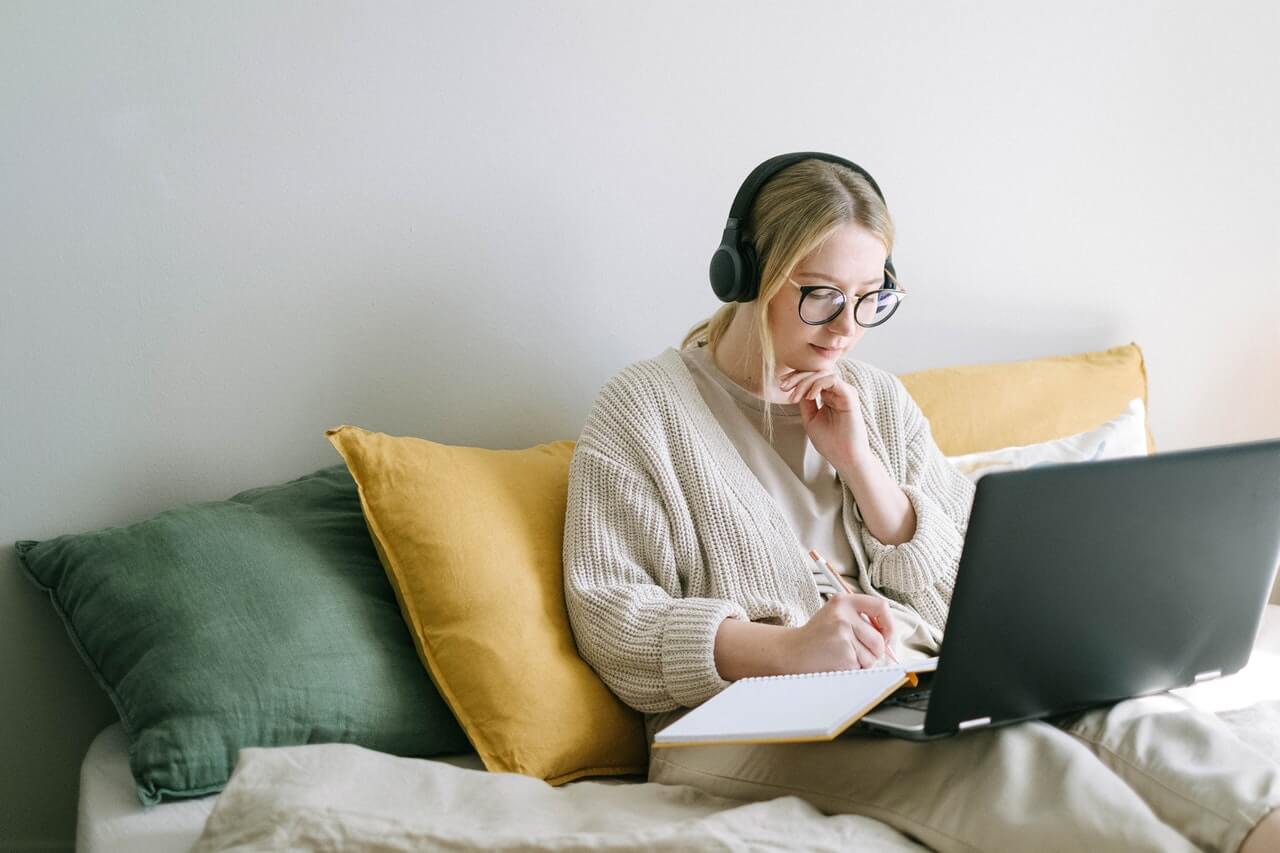 Working lady works remotely from her room