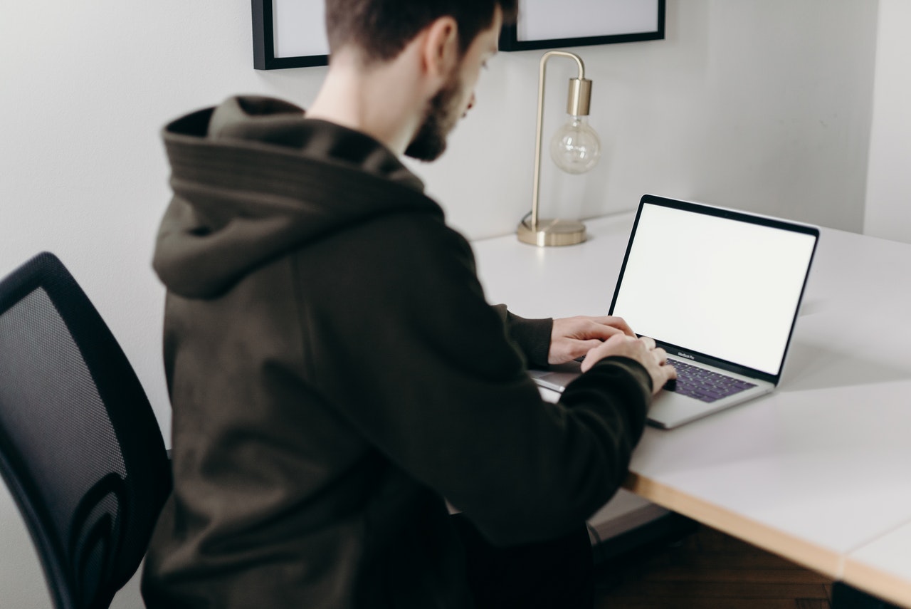 A-young-tech-guy-working-with-his-laptop