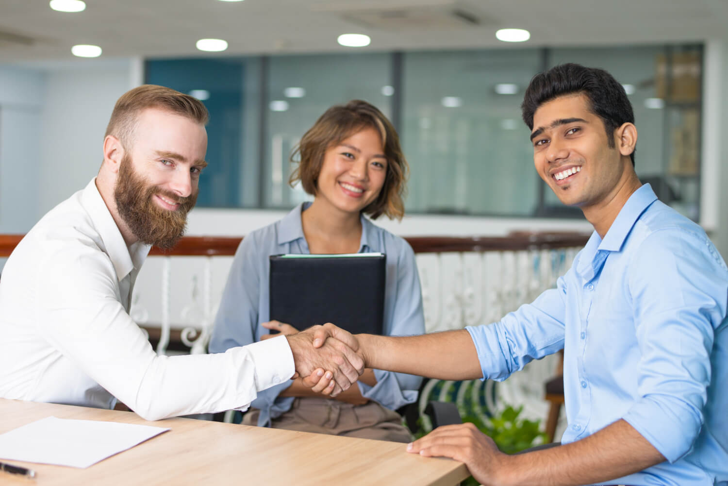 An-employee-being-given-a-handshake-for-a-great-job