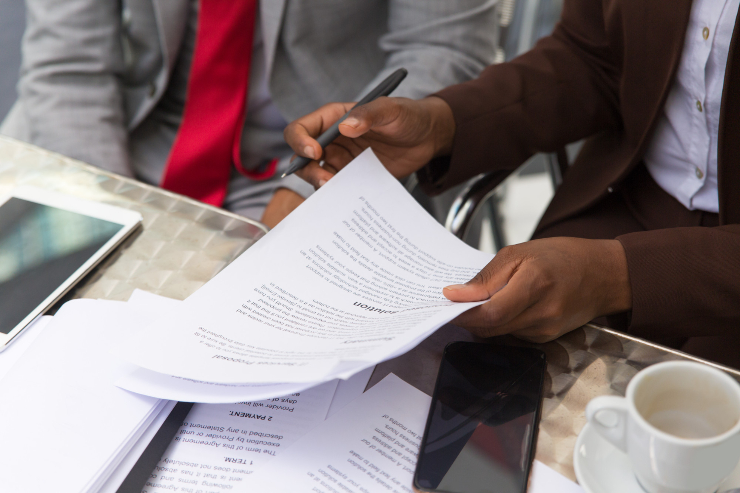 Business men going through documents