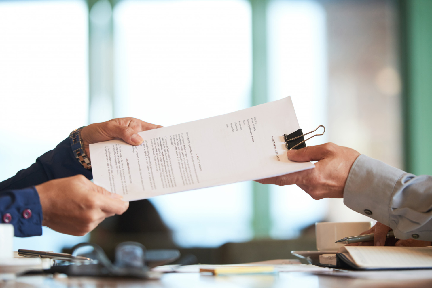 Closeup hands passing document