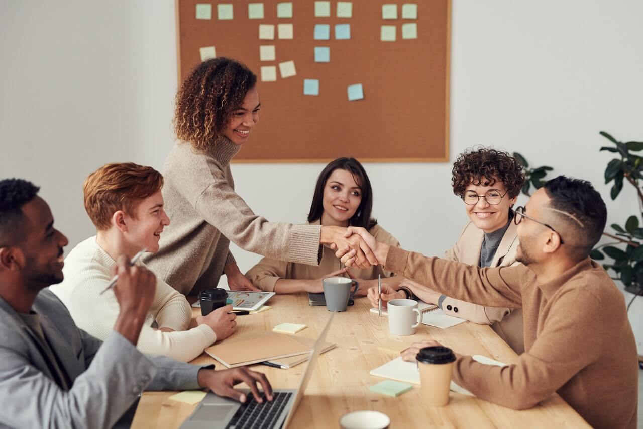 Colleagues smiling and paying attention in a meeting