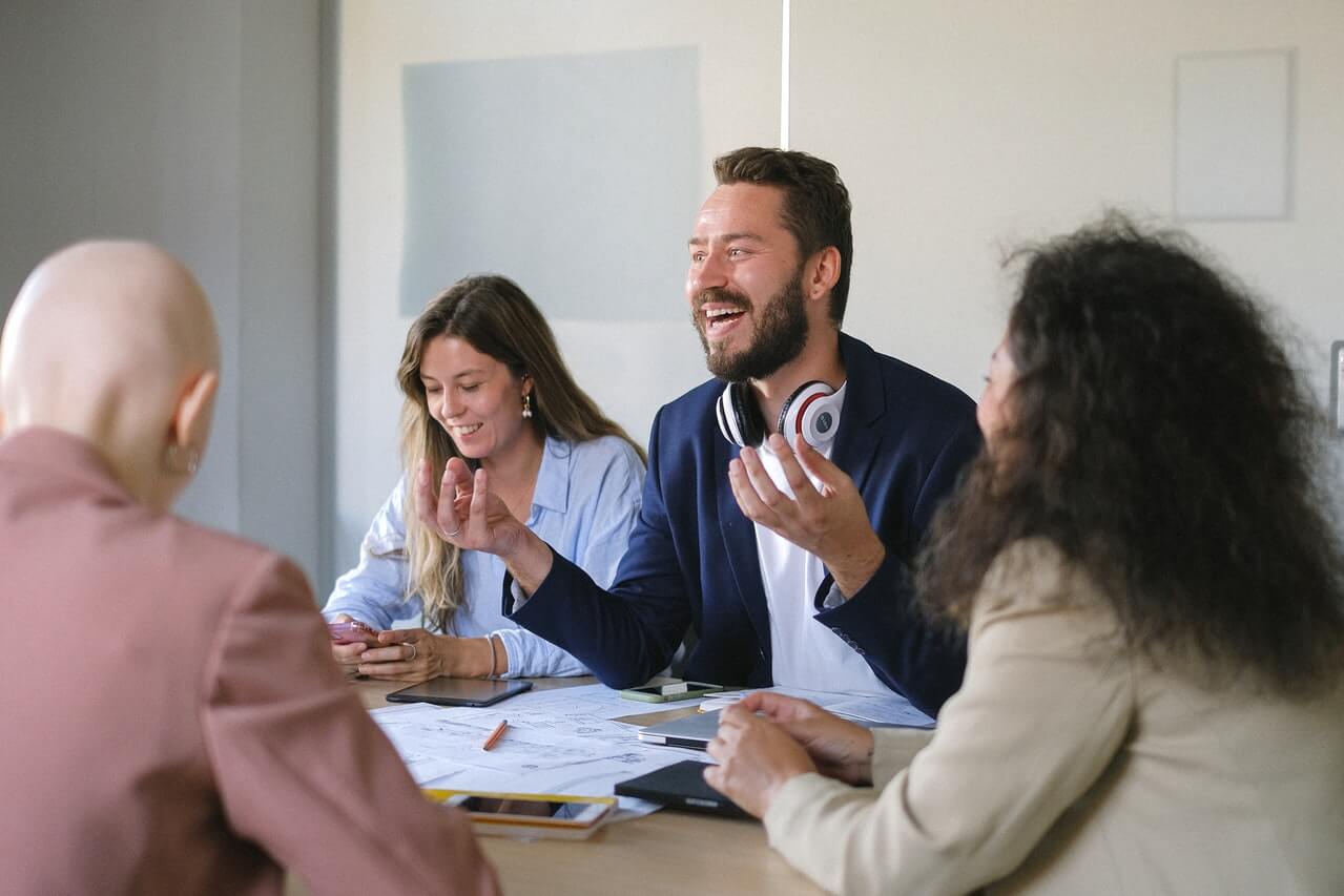 Business people laughing and smiling in a meeting