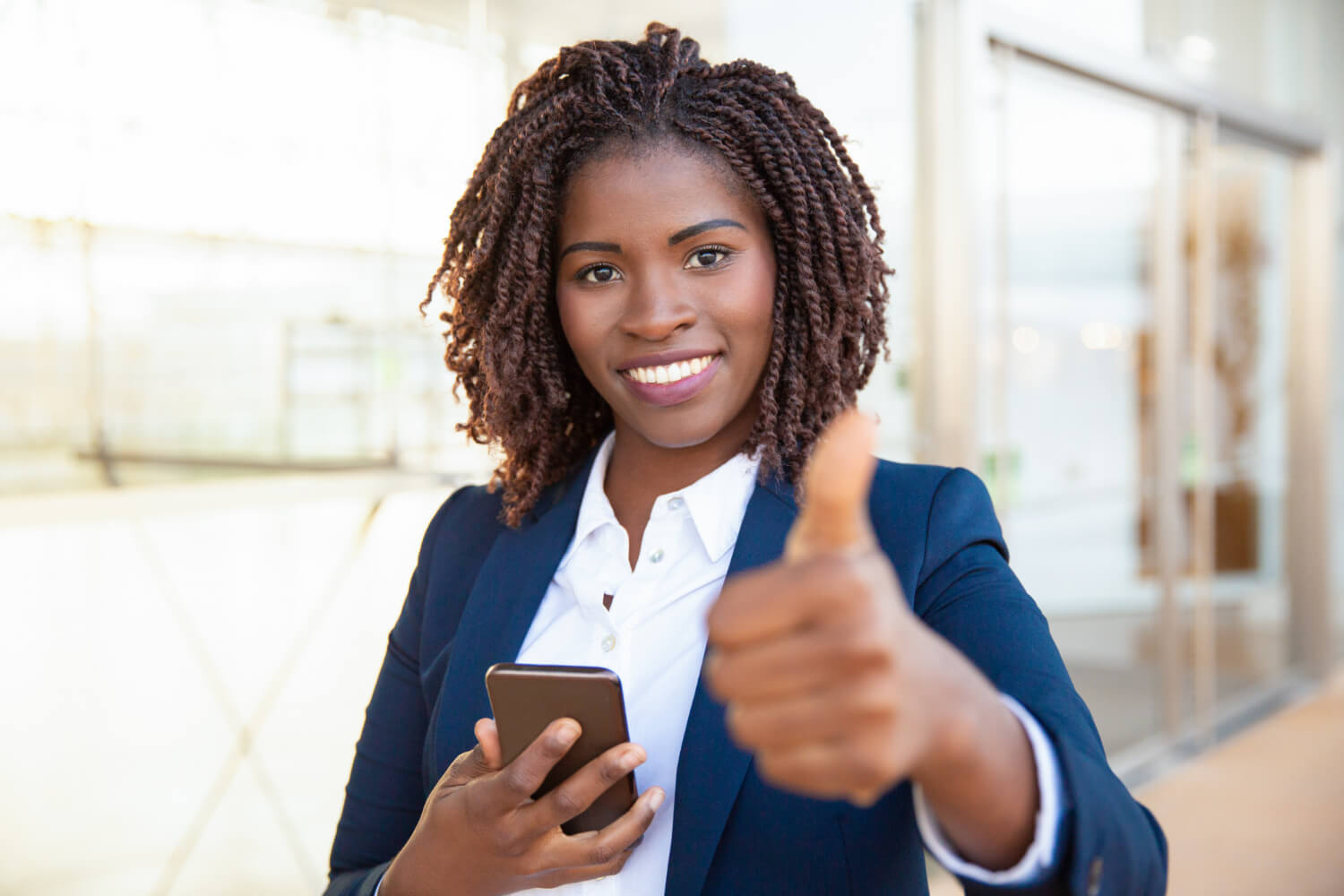 A satisfied customer holding a cellphone