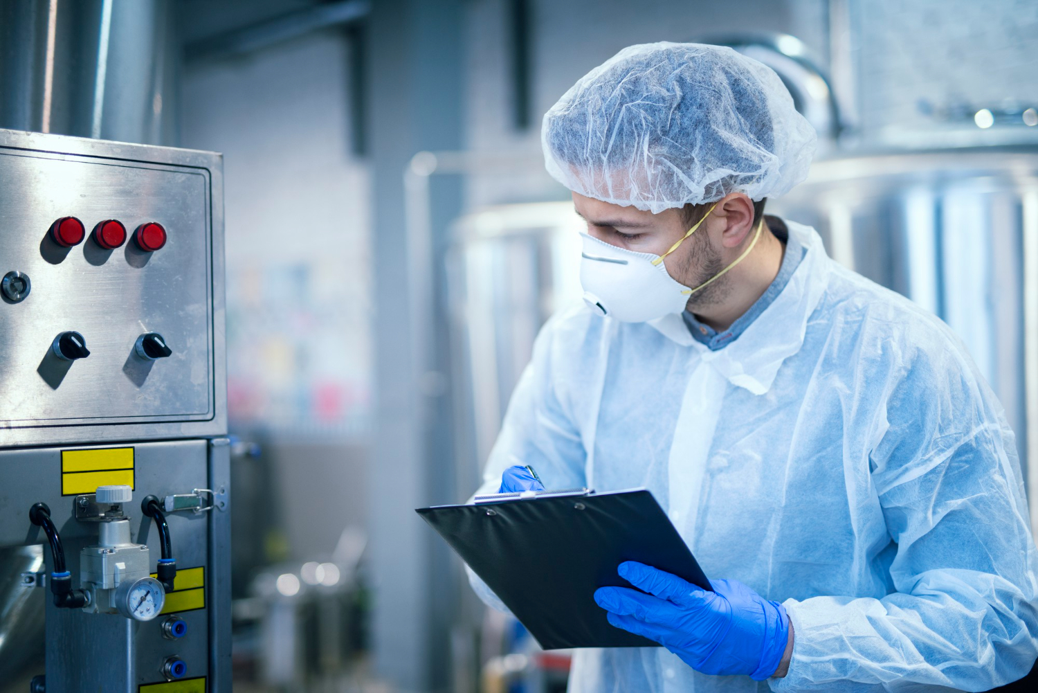 Man checking industrial food production plant