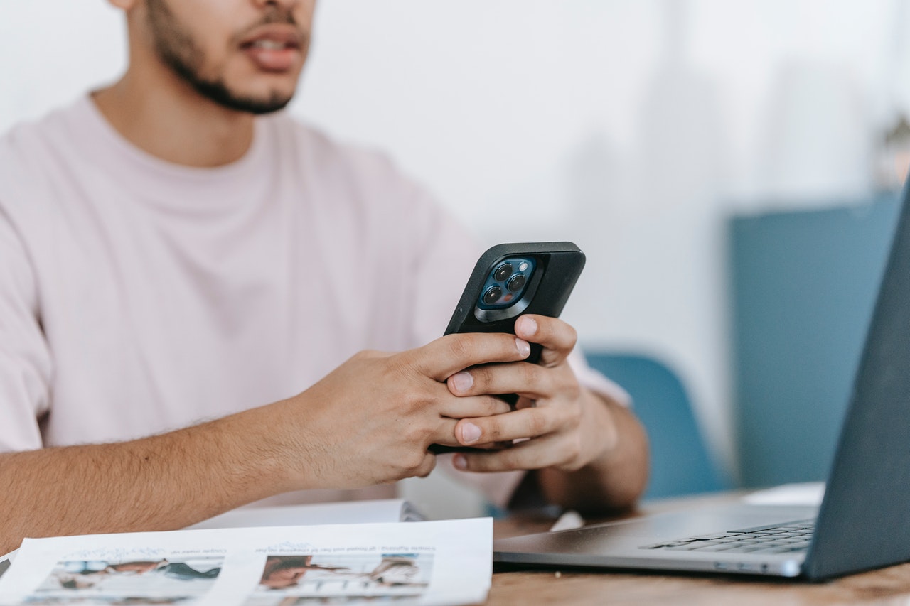 Man looking down at his smartphone