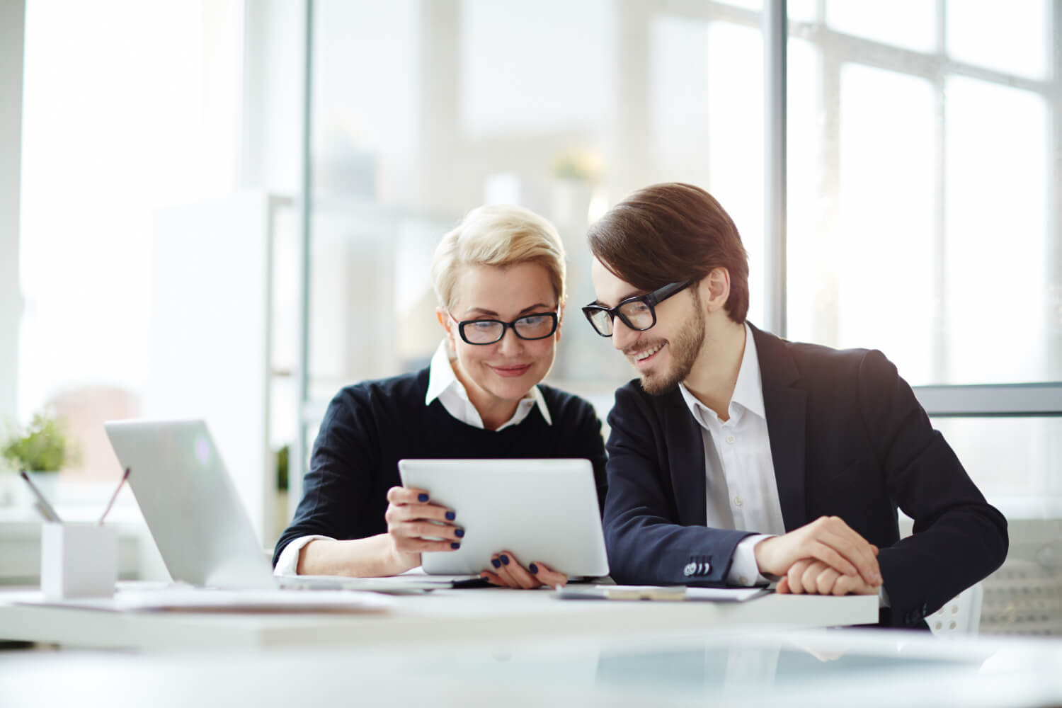 A young man and woman preparing for a presentation