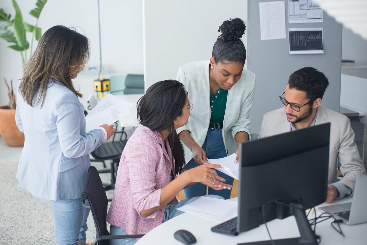 Office workers having a panel of discussion in the office