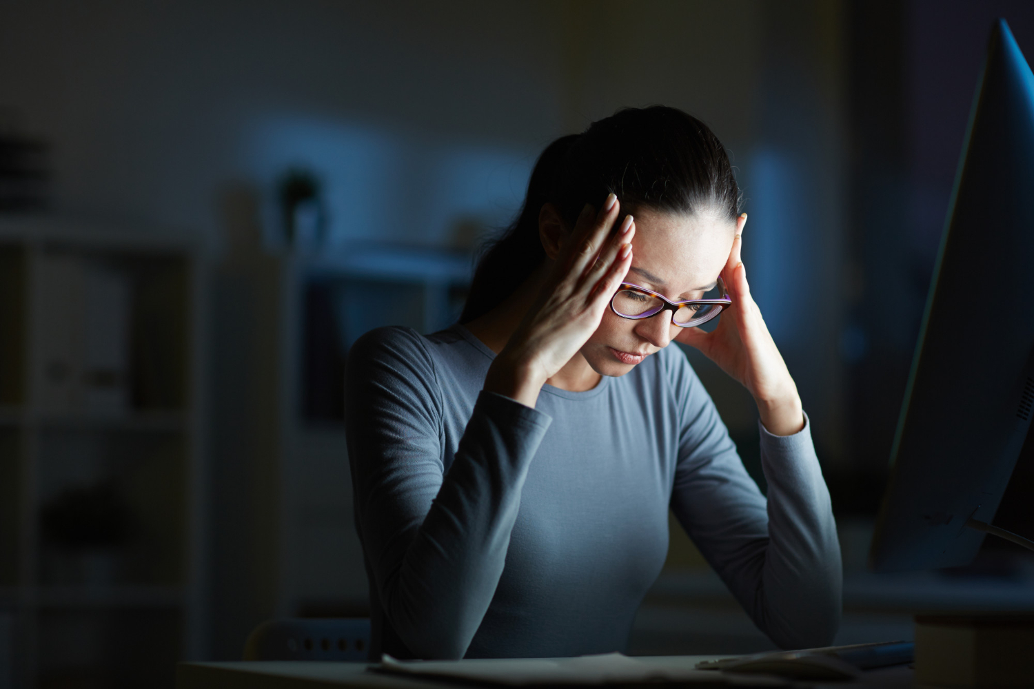 Lady down on her desk looking tired