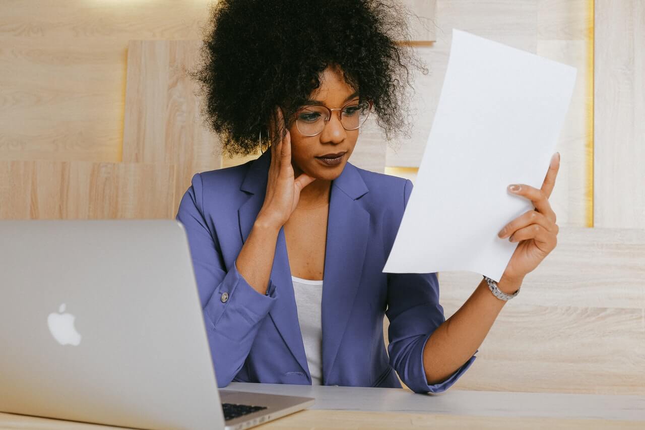 A business woman going through a document