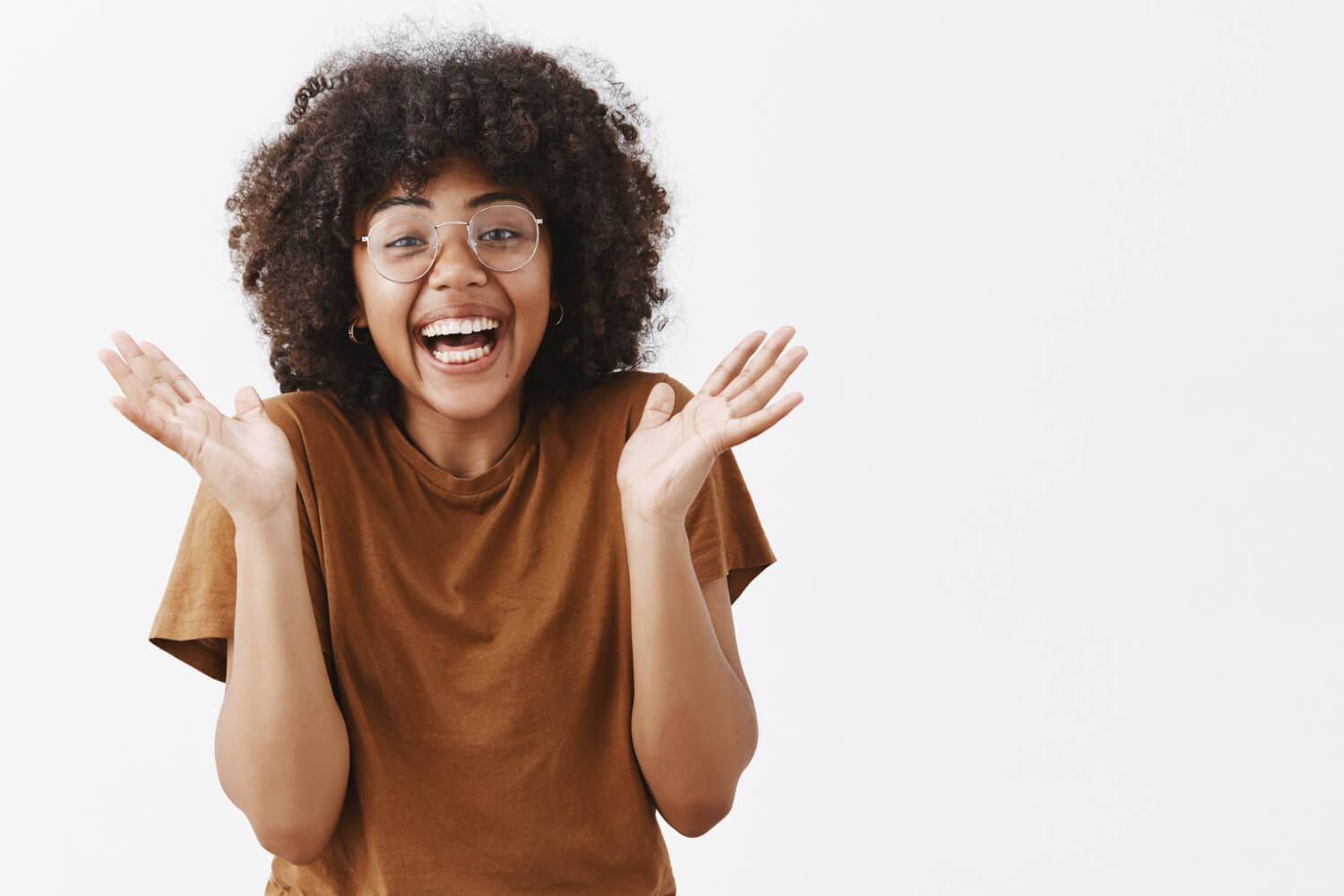 A lady smiling out of joy and excitement