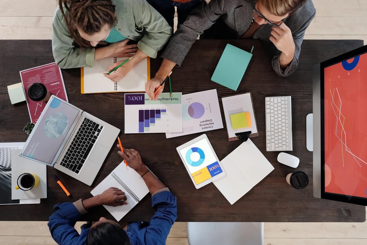 a group of business people creating slides for a presentation