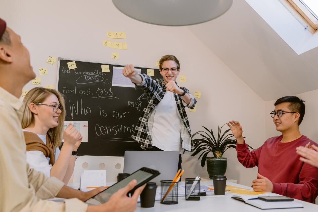 a young man presenting to a group of people