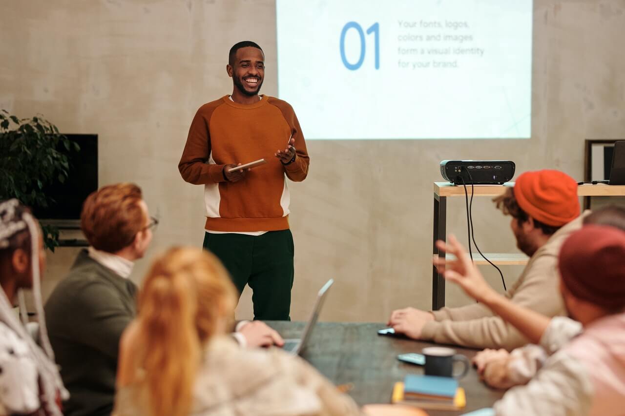 a man delivering a presentation with slides