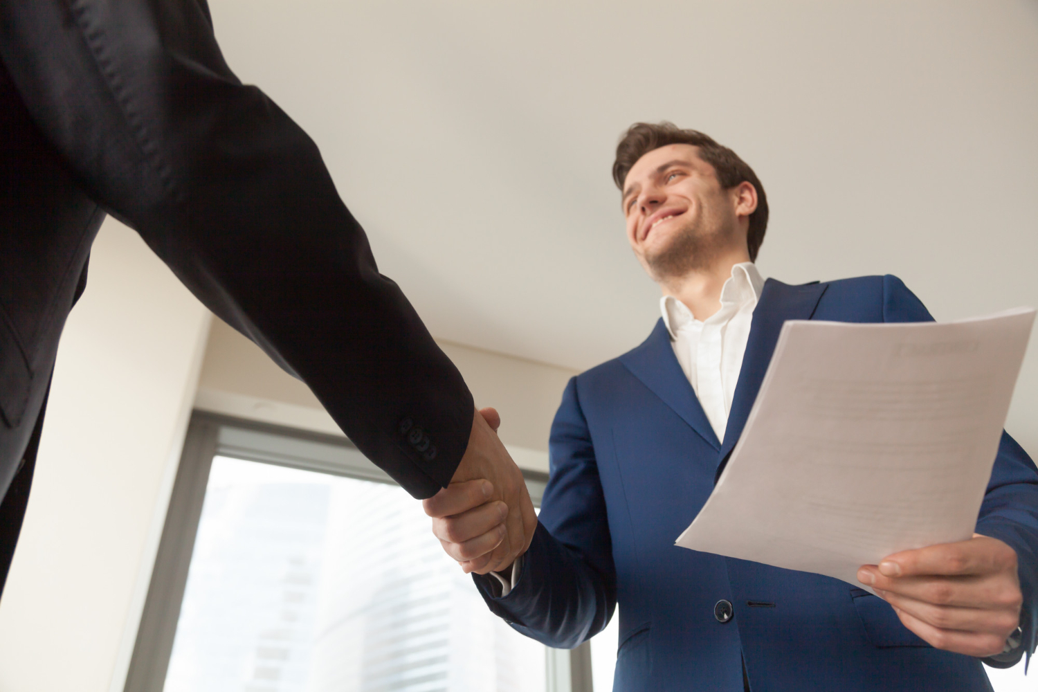 business-man-showing-respect-and-gratitude-to-each-other-with-a-handshake