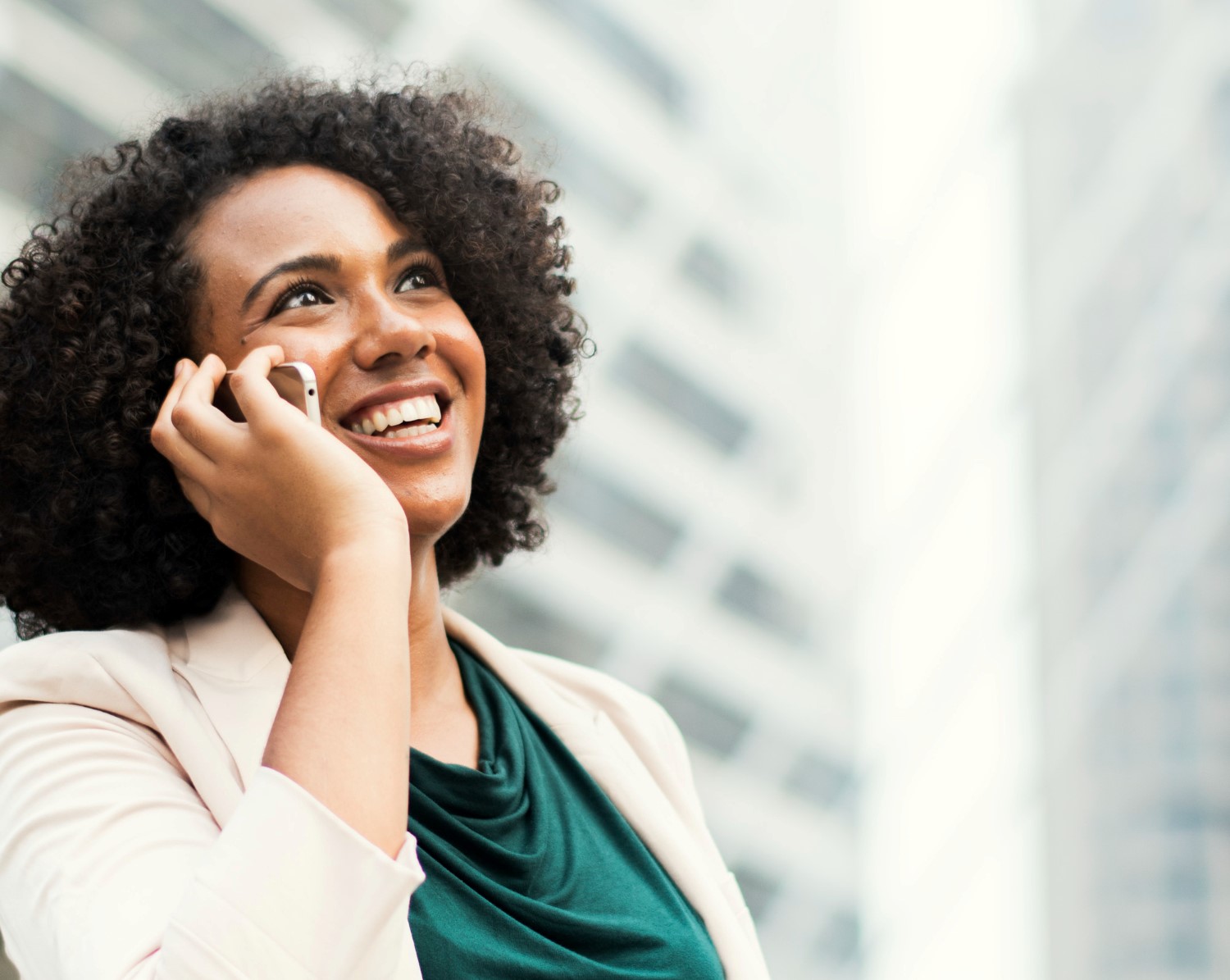 Happy business woman talking on the phone