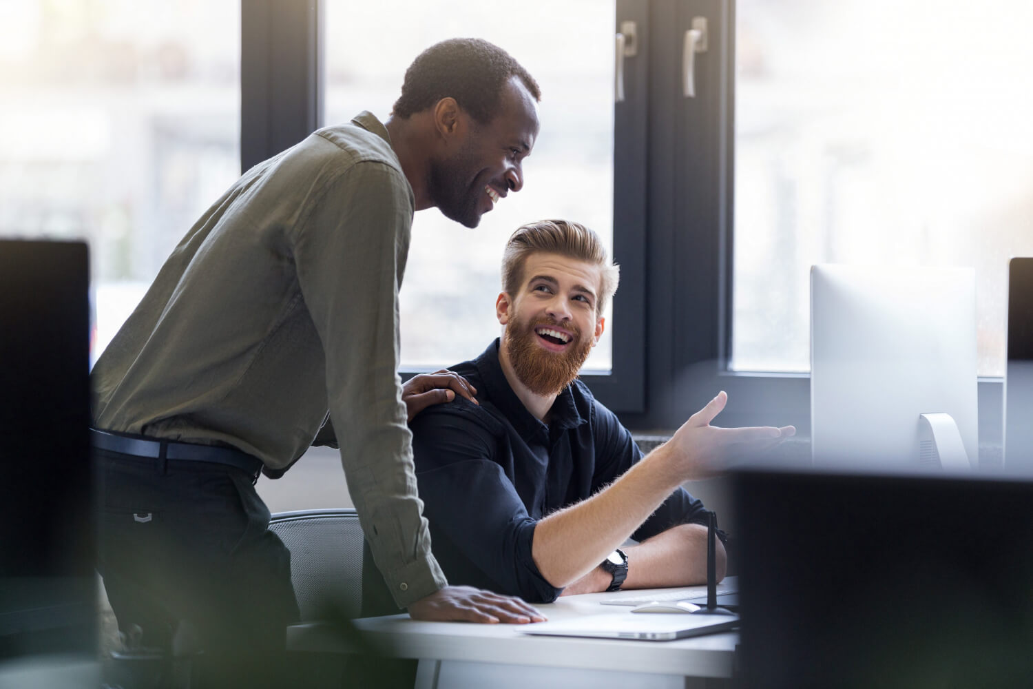 two-happy-men-working-together-new-business-project