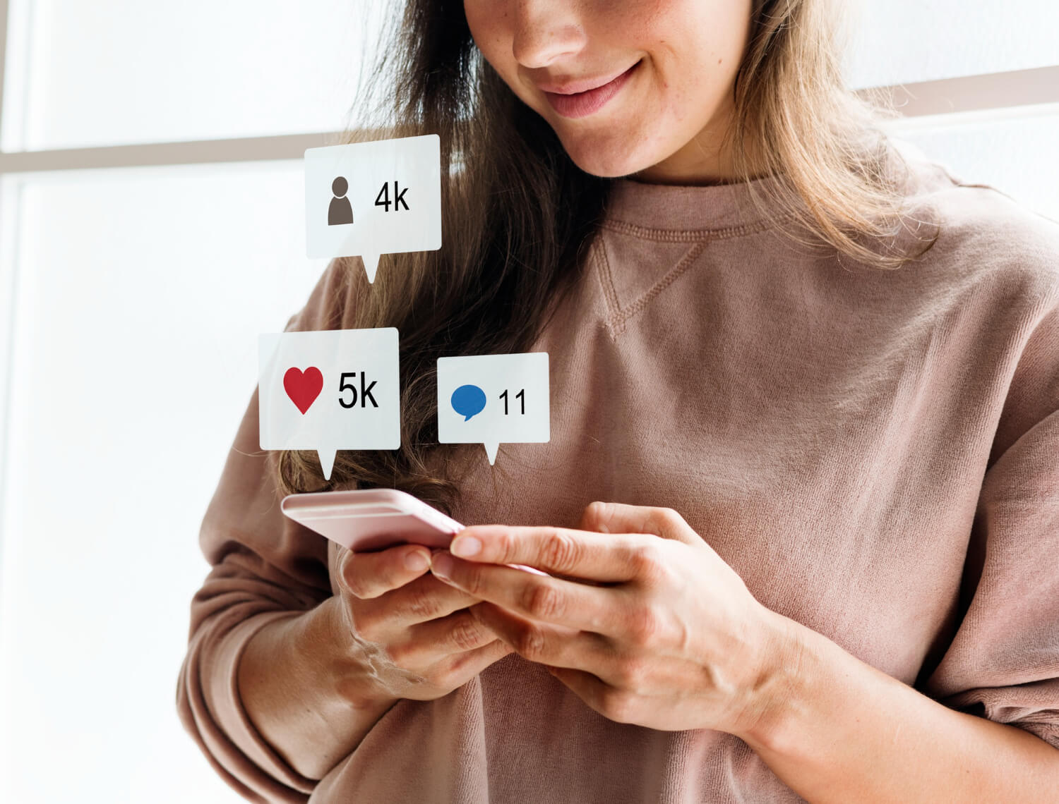 A lady using smartphone to monitor her social media life