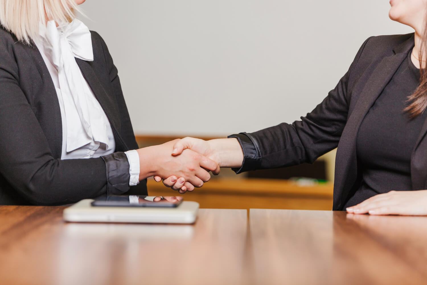 women shaking hands after a meeting