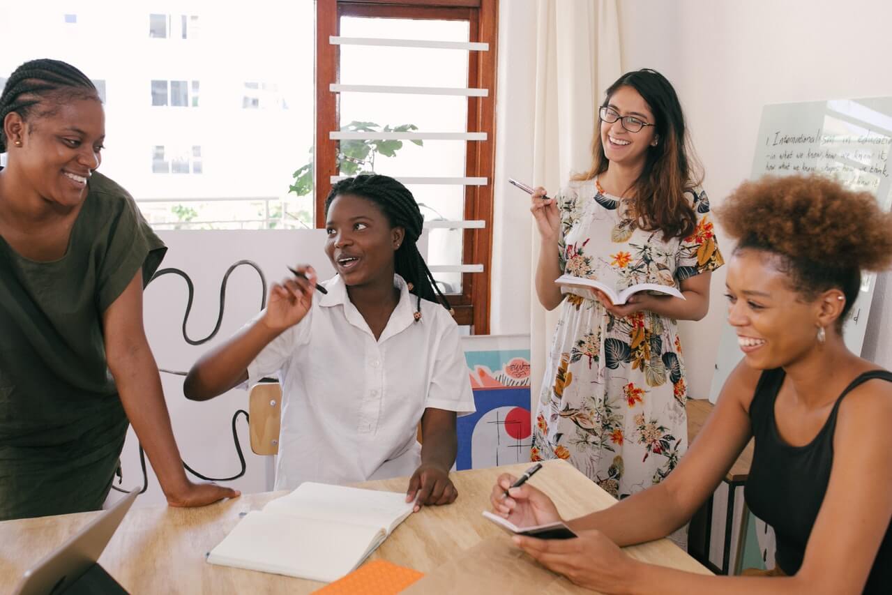 business women laughing during a presentation