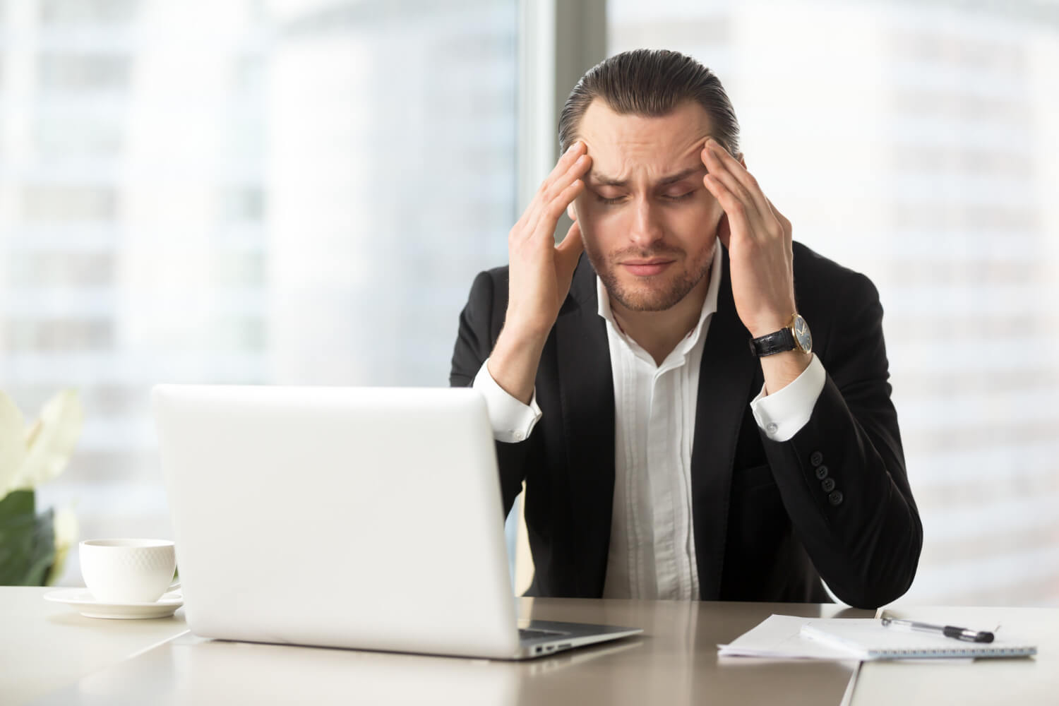 A-business-man-tired-from-thinking-during-office-hours