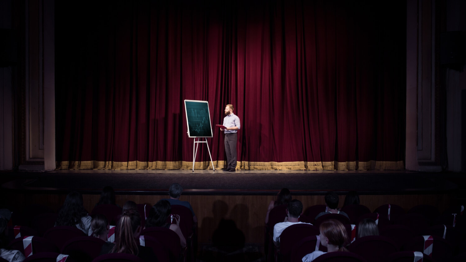 A-speaker-giving-a-presentation-to-students-in-a-business-summit