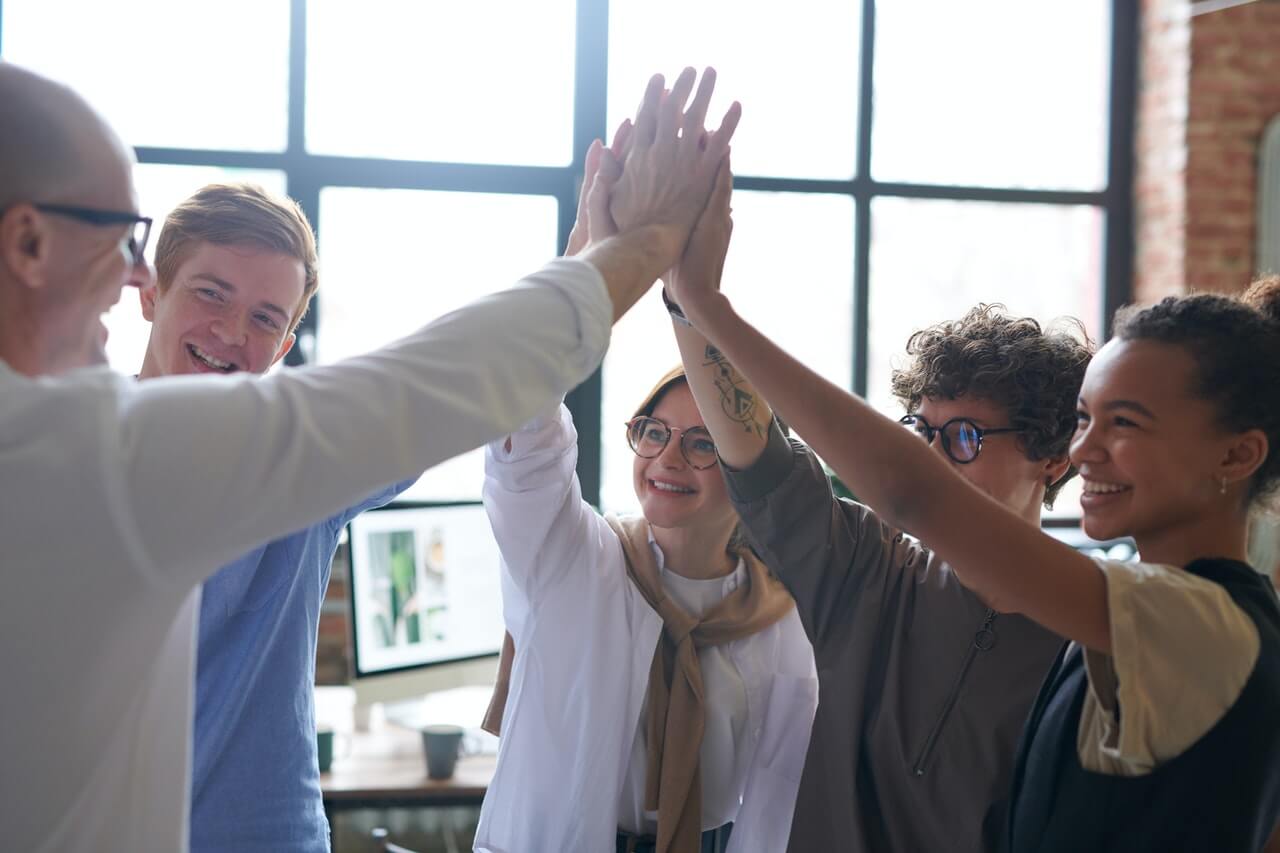 A team having a team high five happily