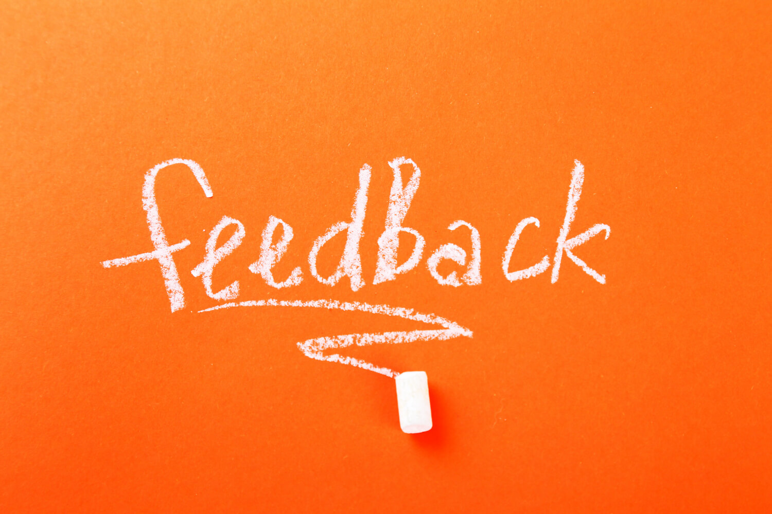 Feedback written on an orange background