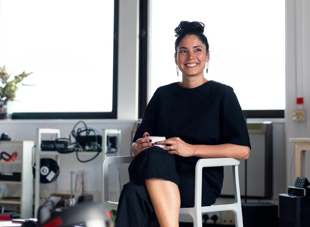 Portrait of business woman sitting on chair