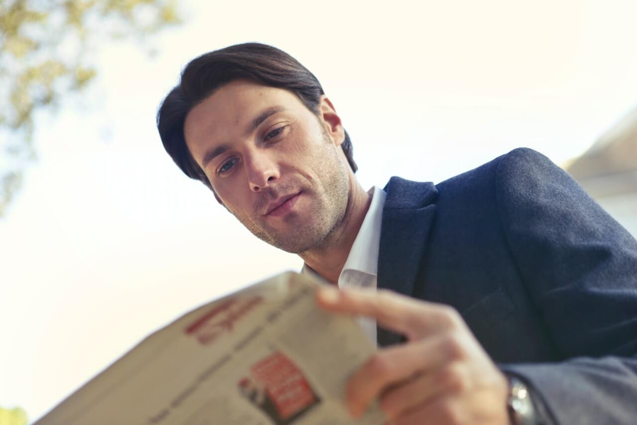 Businessman reading a newspaper