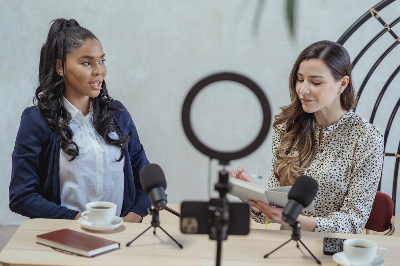 Young lady on a blue suit been interviewed