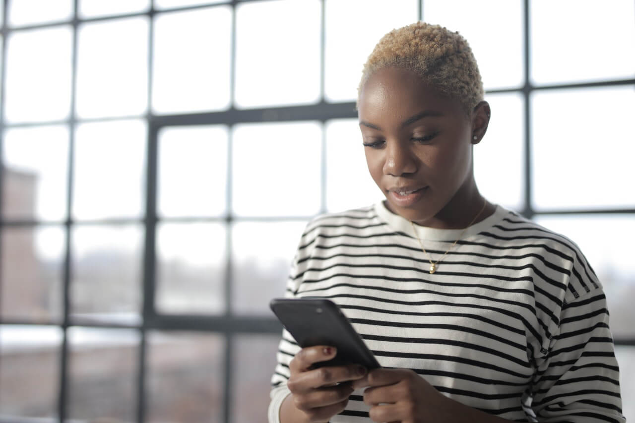 Woman looking down at her phone