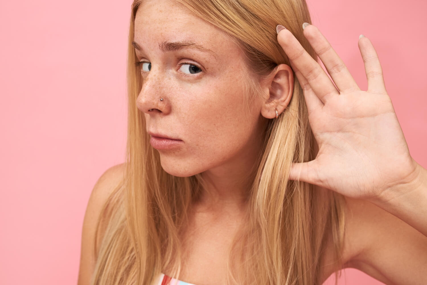 Young curious girl listening