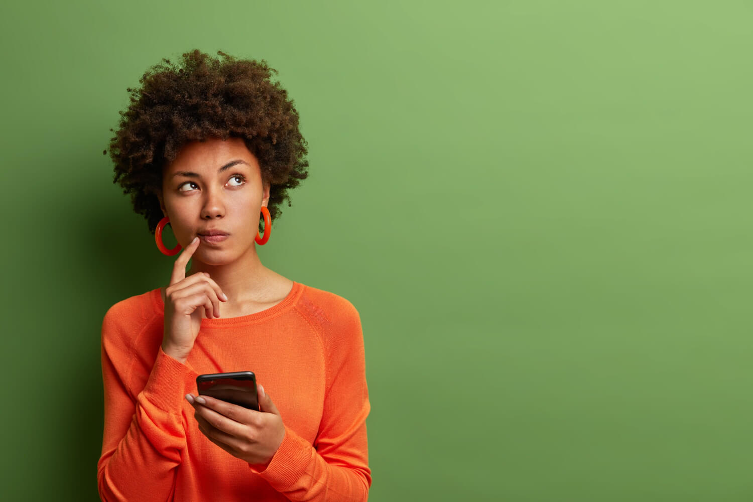 Young lady ponders on a question