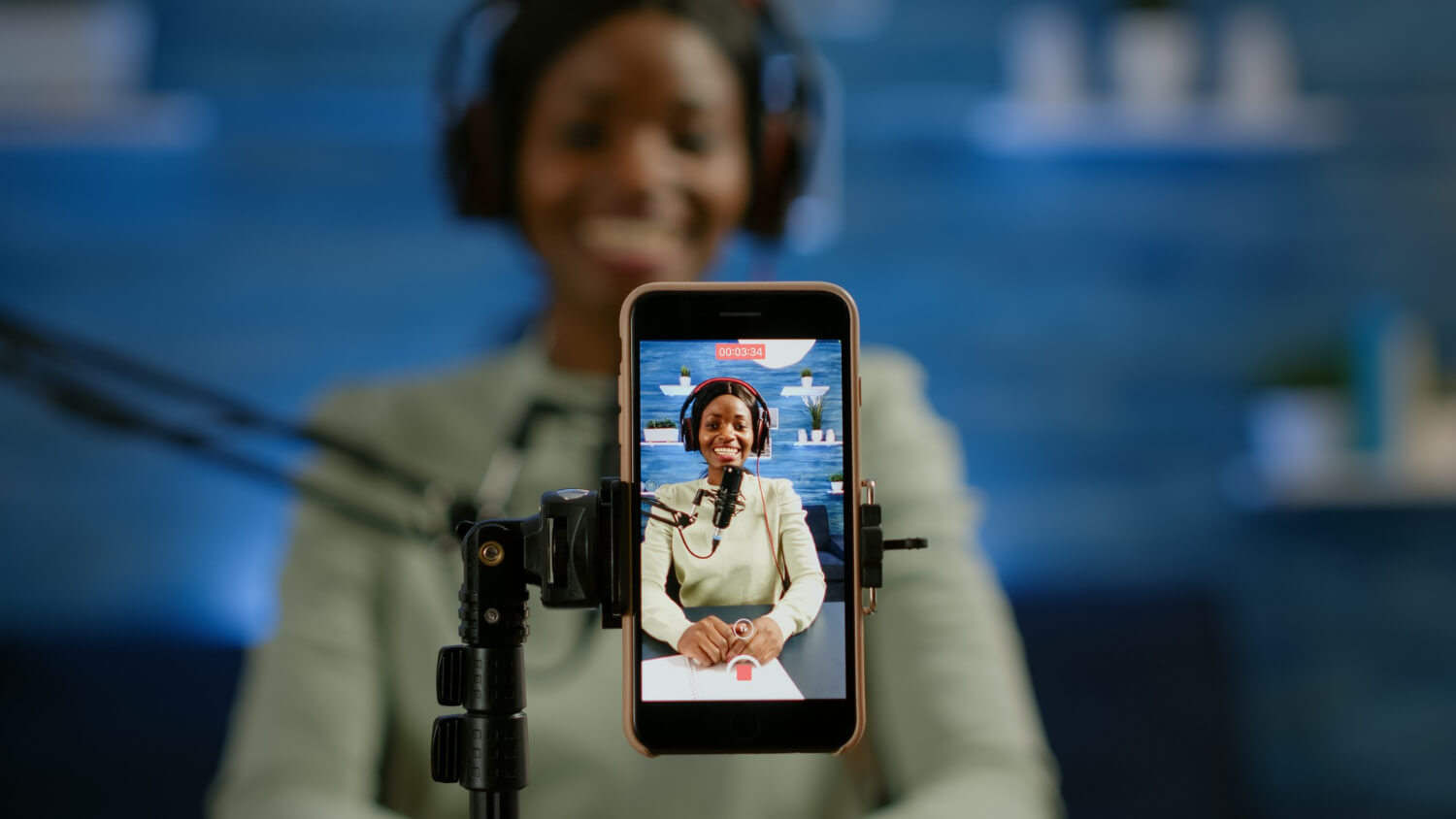 Young lady recording herself with a smart phone