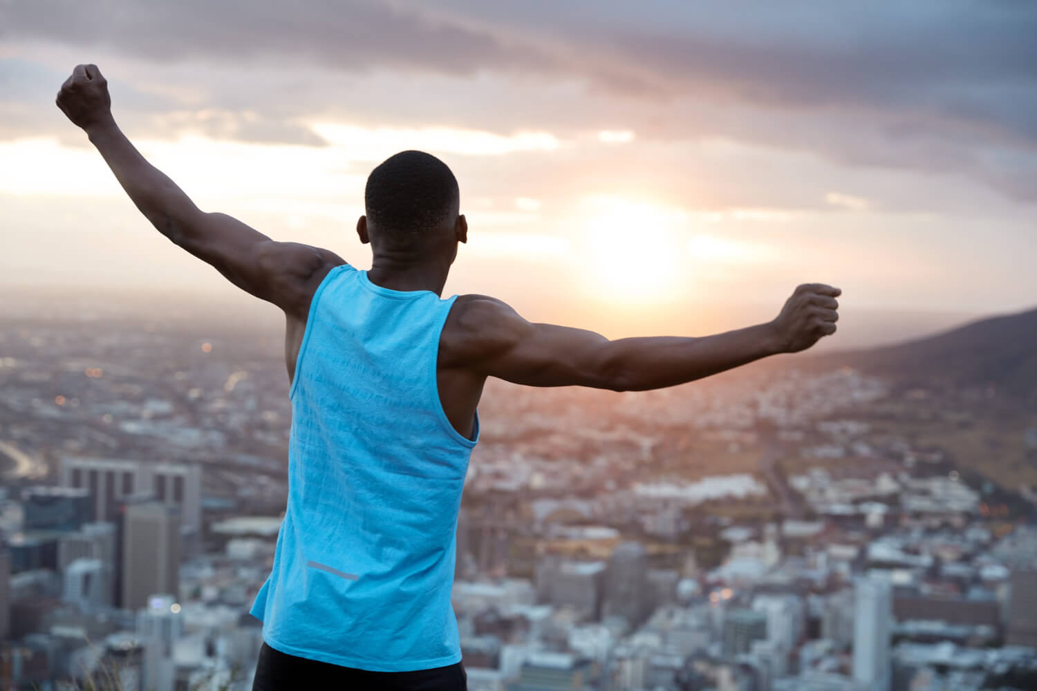 carefree-independent-man-enjoys-panoramic-view-with-sunrise-recreation-concept