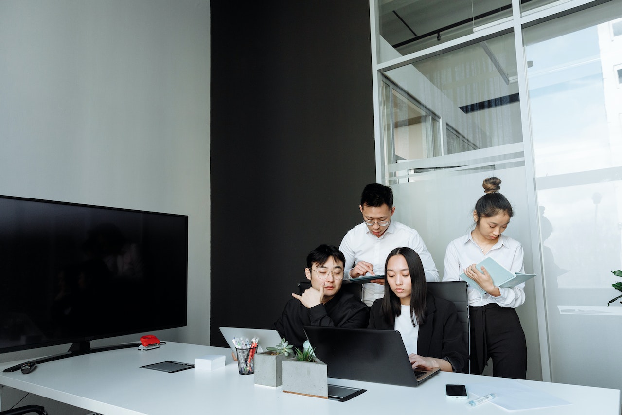 A Group of People Having a Meeting in the Office