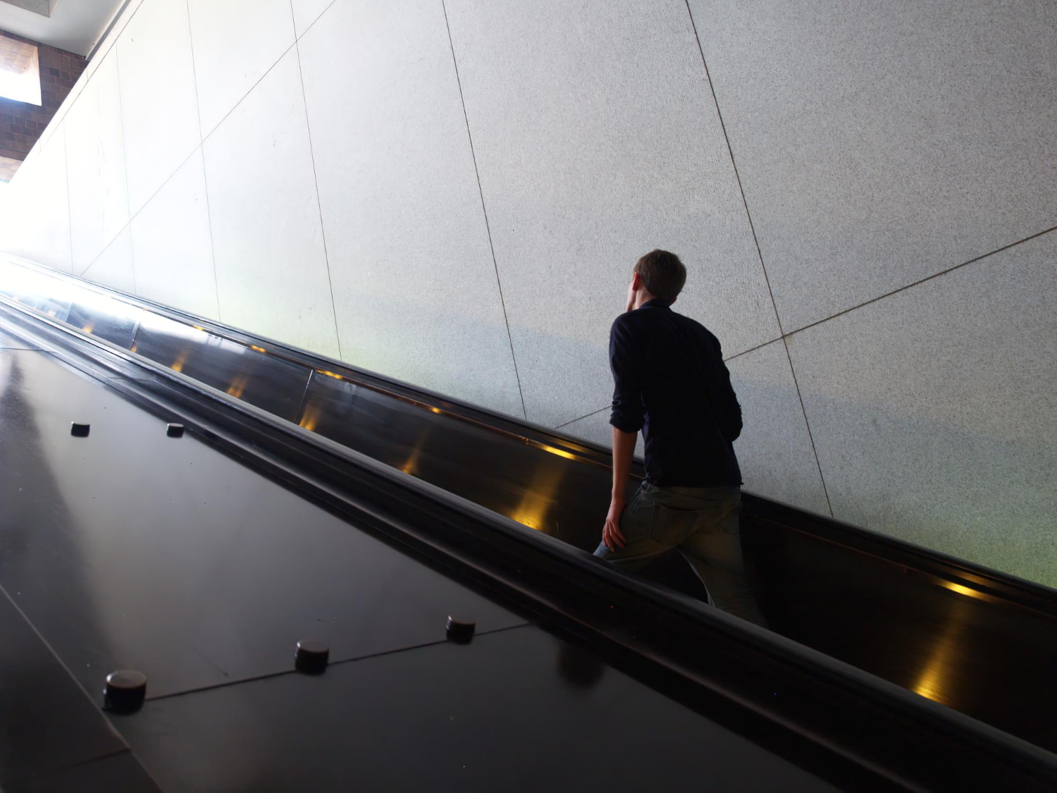 A-person-moving-up-an-escalator-rising-new-heights.