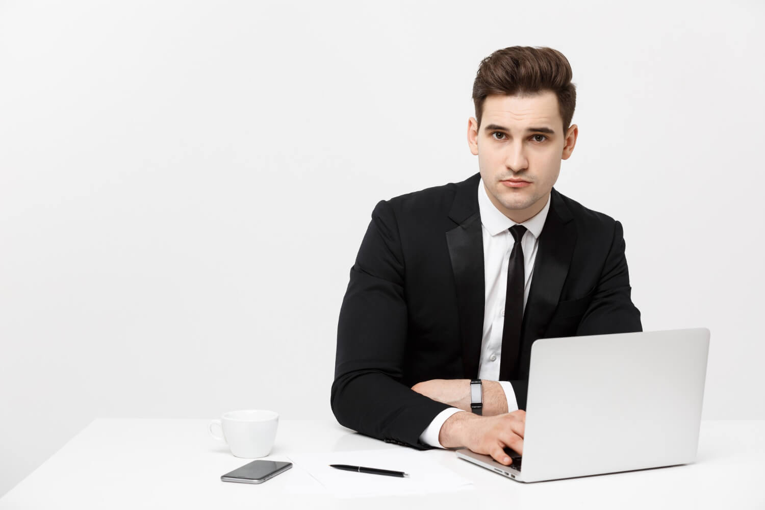 A-self-sufficient-businessman-in-his-office-looking-at-the-camera