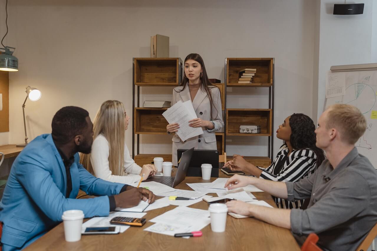 A young woman reporting in a meeting