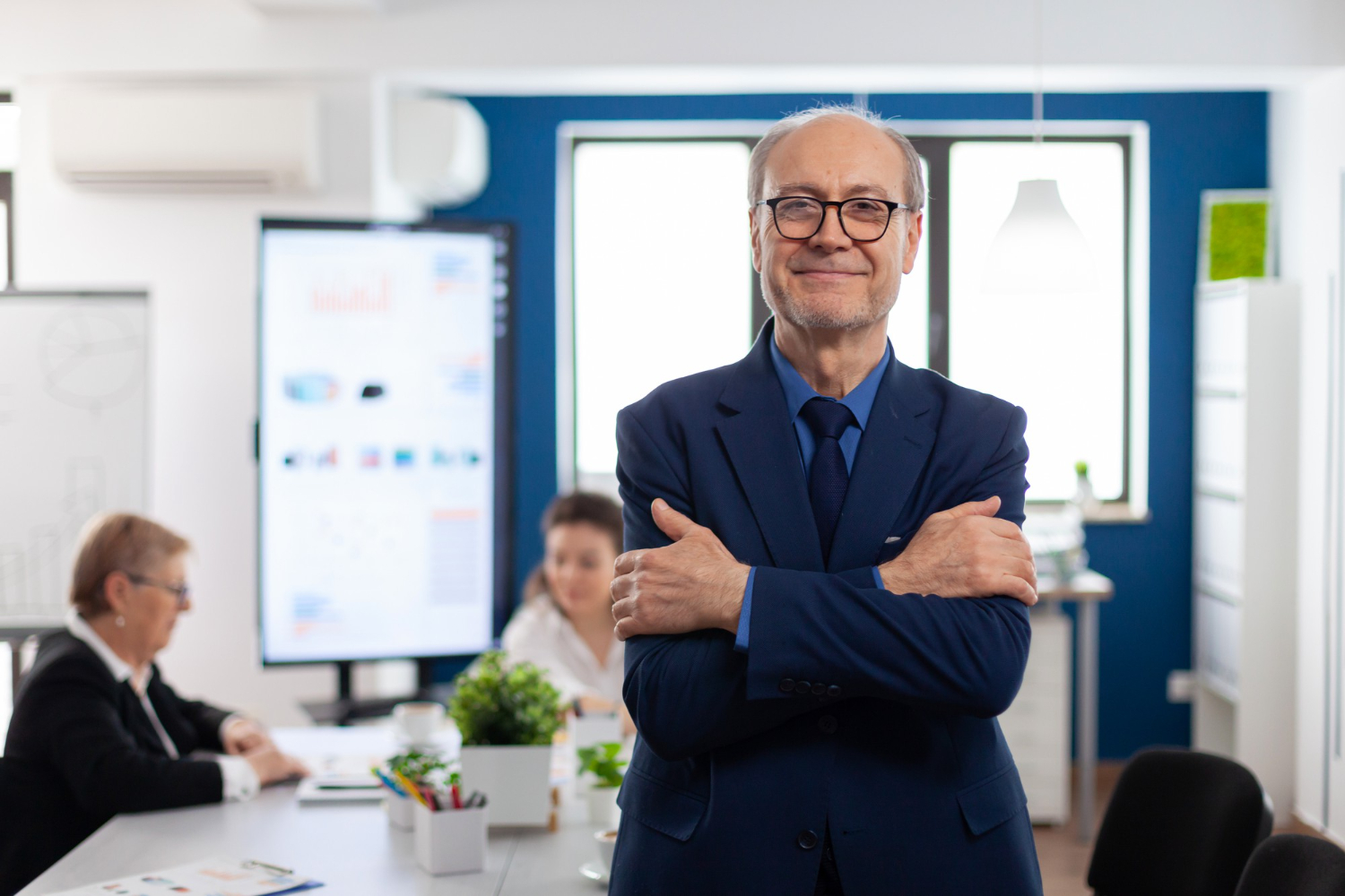 An office team leader standing and posing to a camera