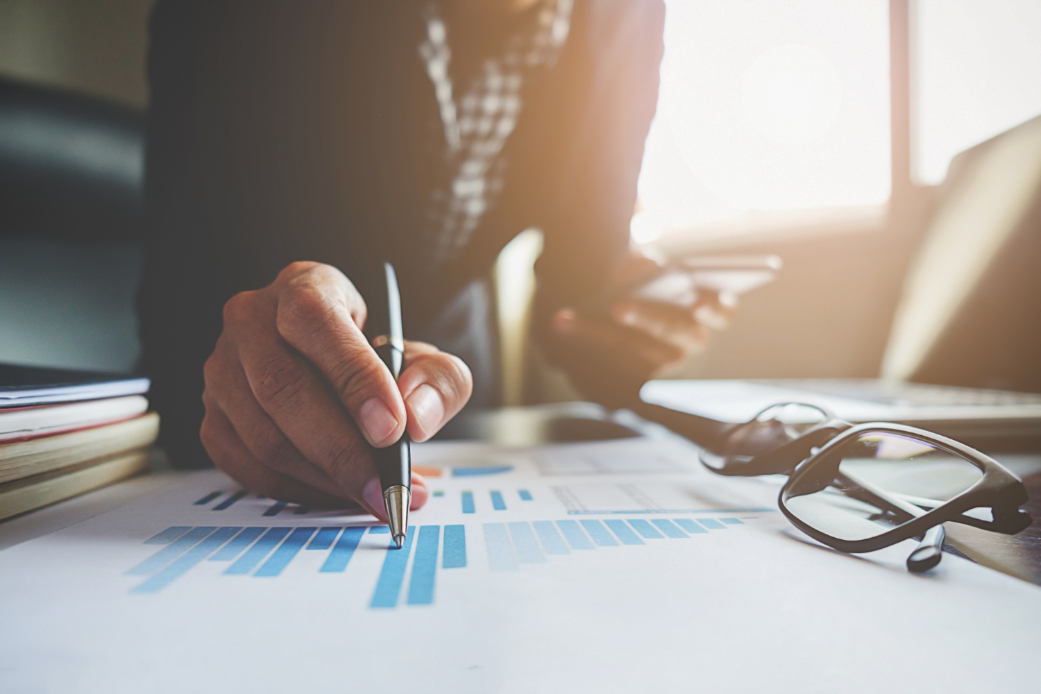 Business woman working on a finance graph