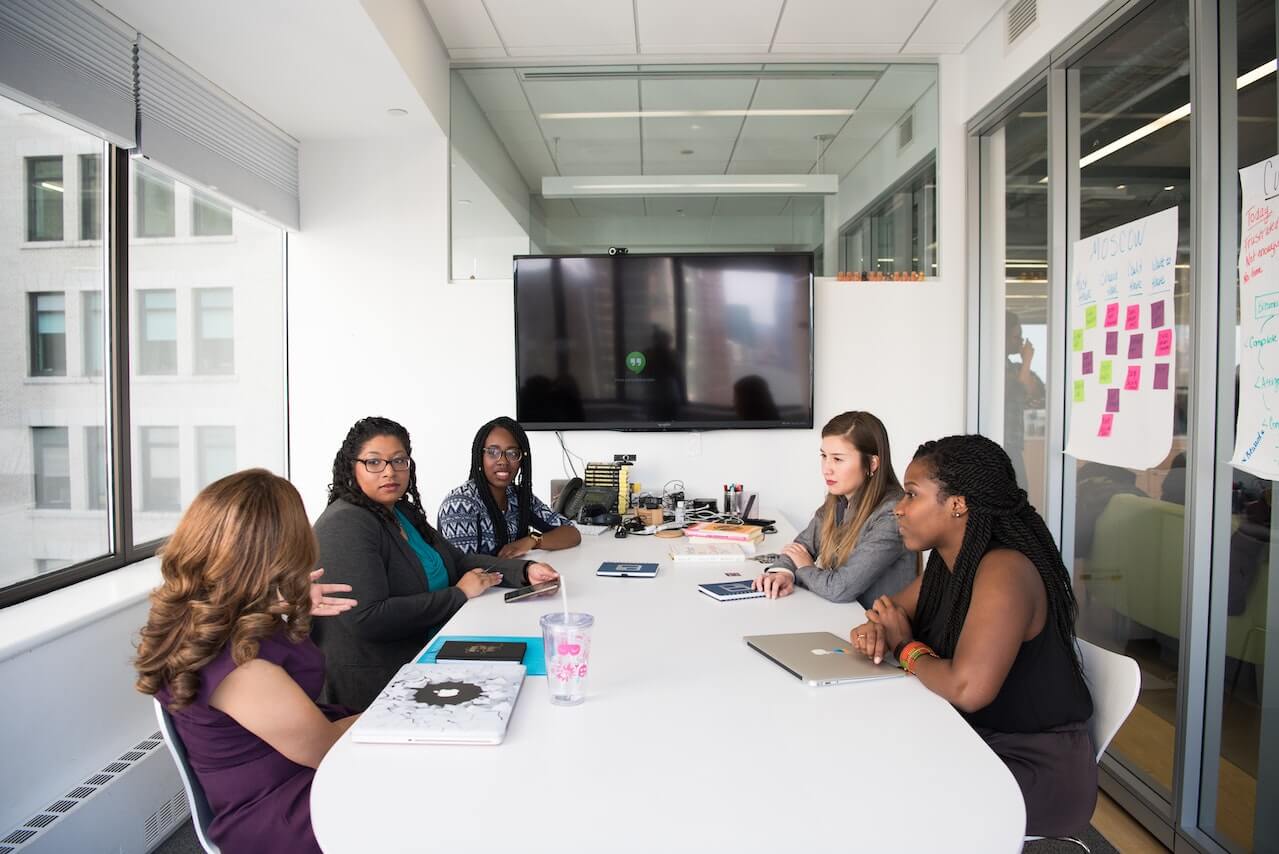 Business women gathered inside a conference room