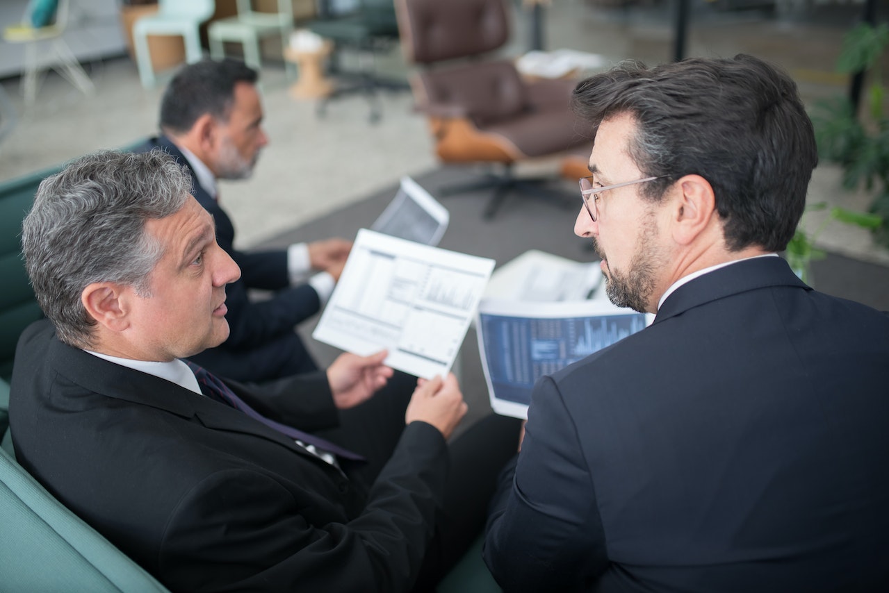 Group-of-male-managers-discussing-their-managerial-problems-in-a-meeting