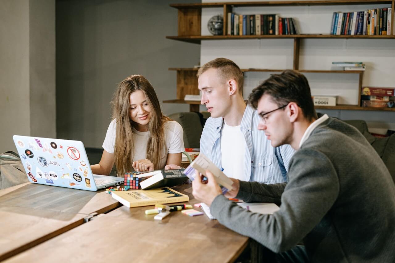 Group of people working together while smiling