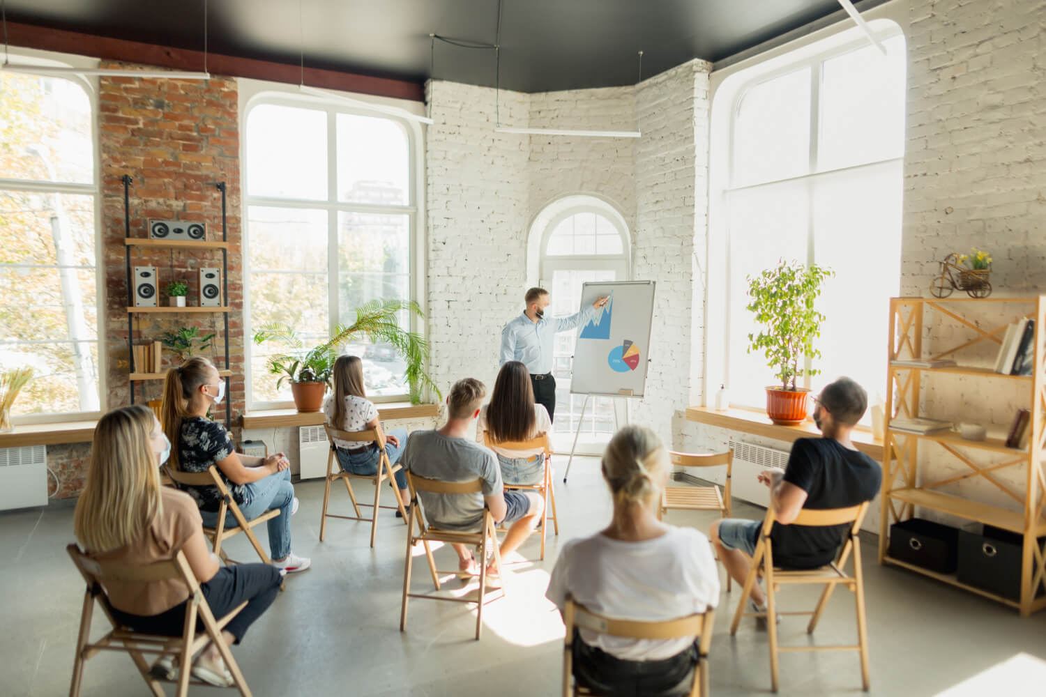 Male-speaker-talking-to-an-audience-in-a-meeting