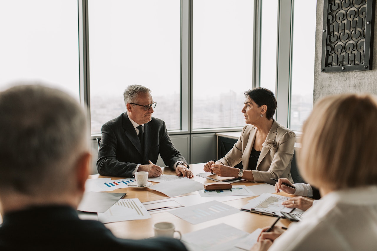 Man and Woman Discussing Business in a Meeting