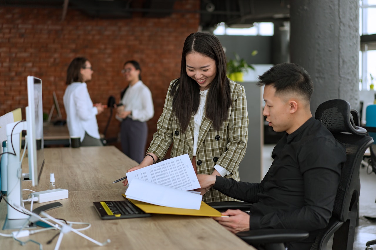 Man and Woman Working at the Office