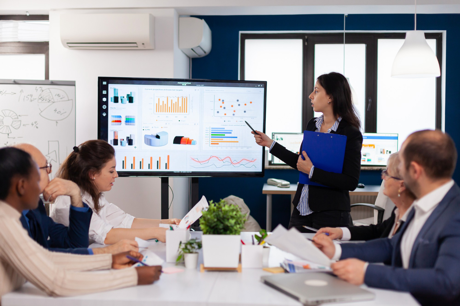 A female staff communicating a strategic plan to management